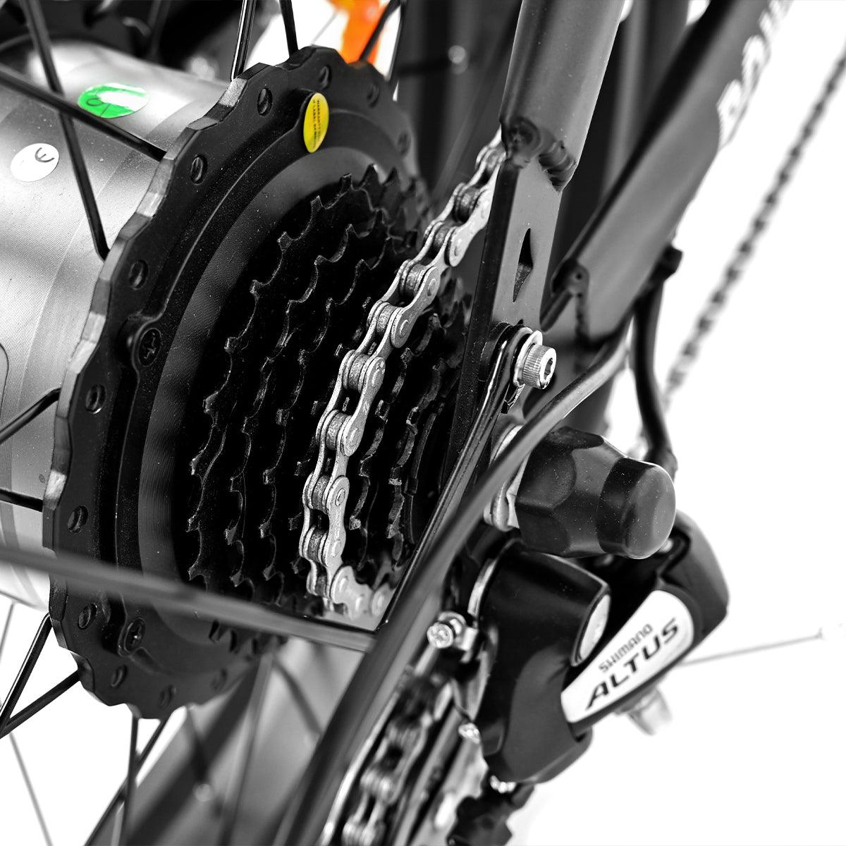 flywheel, transmission, motor and chains on the wheel